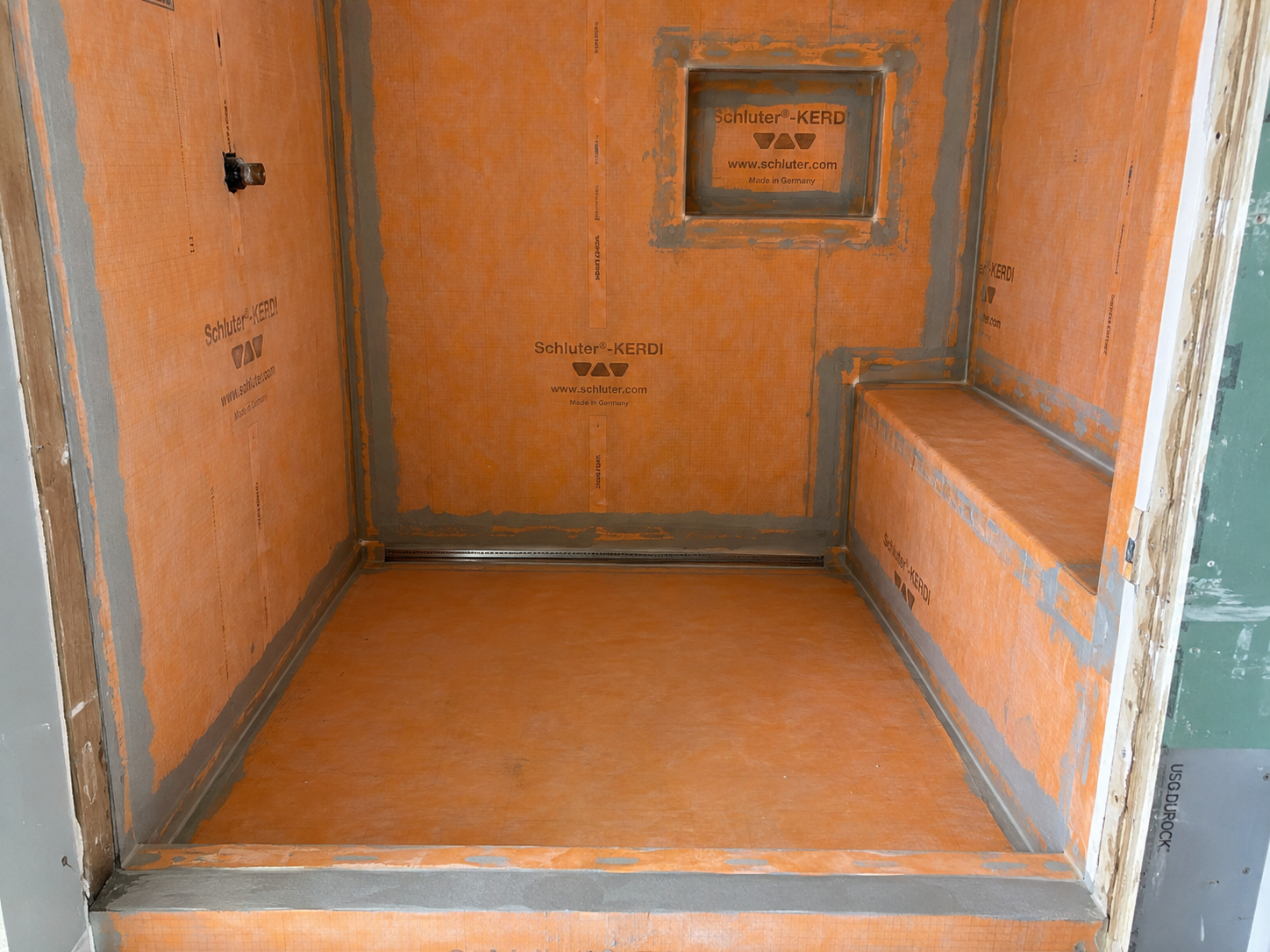 Shower tile installation Irvine CA with waterproofing membrane before tile